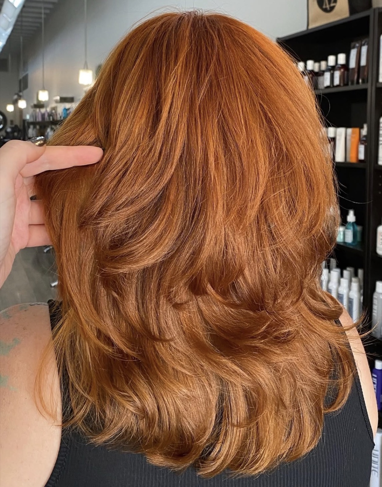 Copper red layered shag with curtain bangs