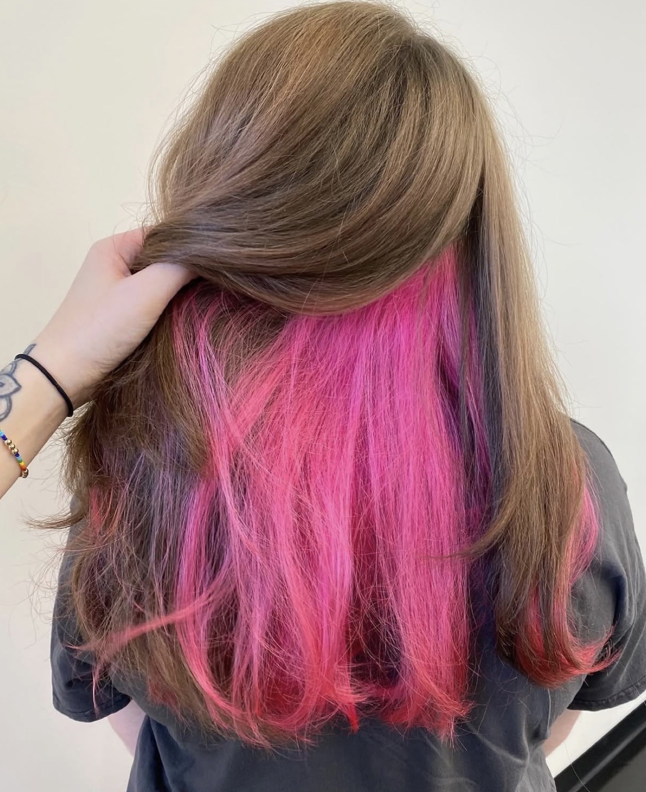 Brown hair with hidden hot pink underlayer