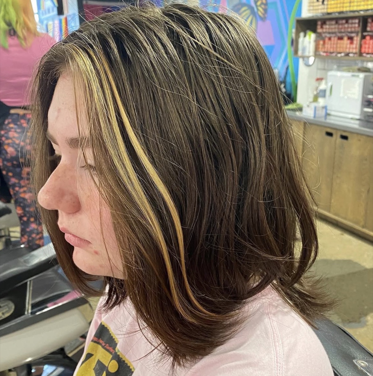 Brown hair with single yellow streak before