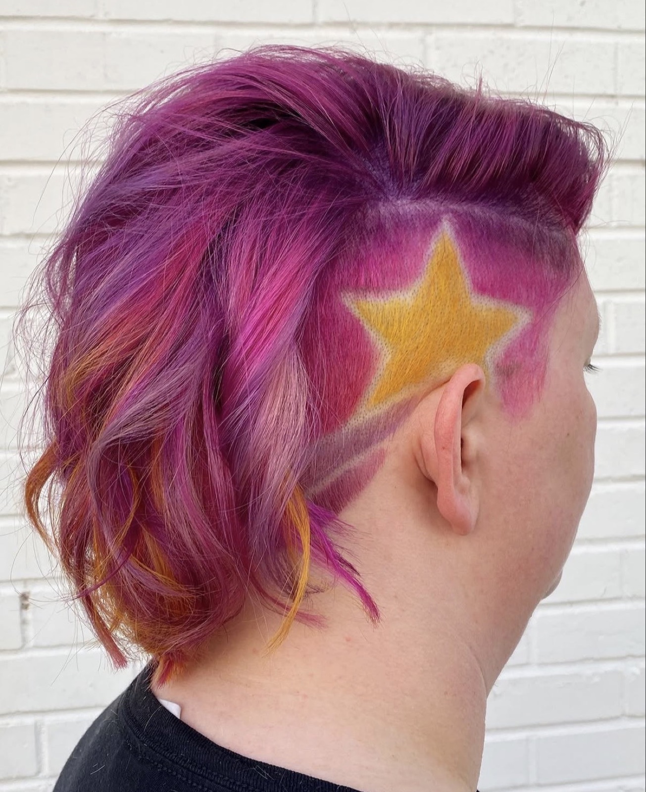 Magenta hair with shaved star after